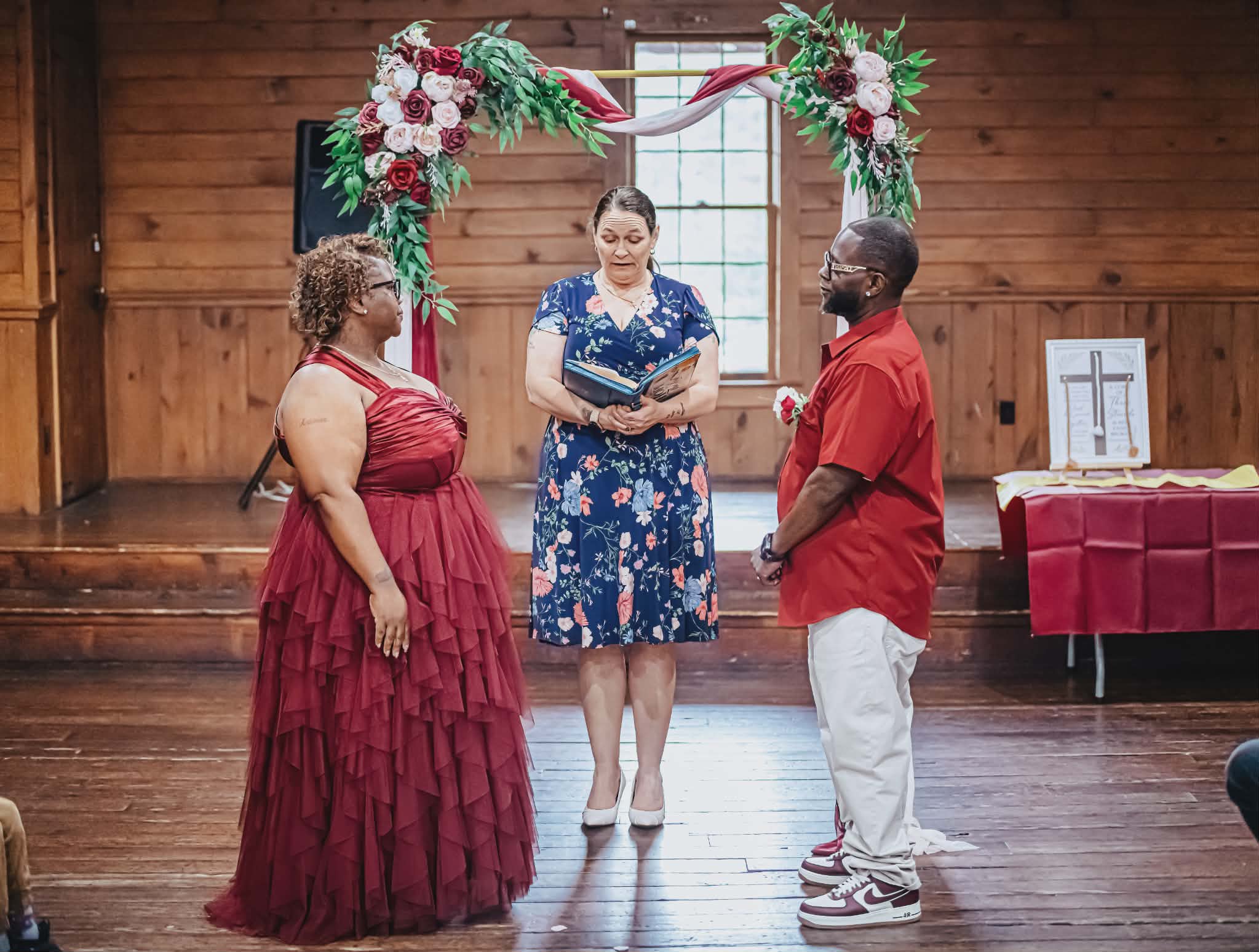 Brandy Vermette-Chapman officiating a wedding ceremony for a couple at a rustic North Carolina venue